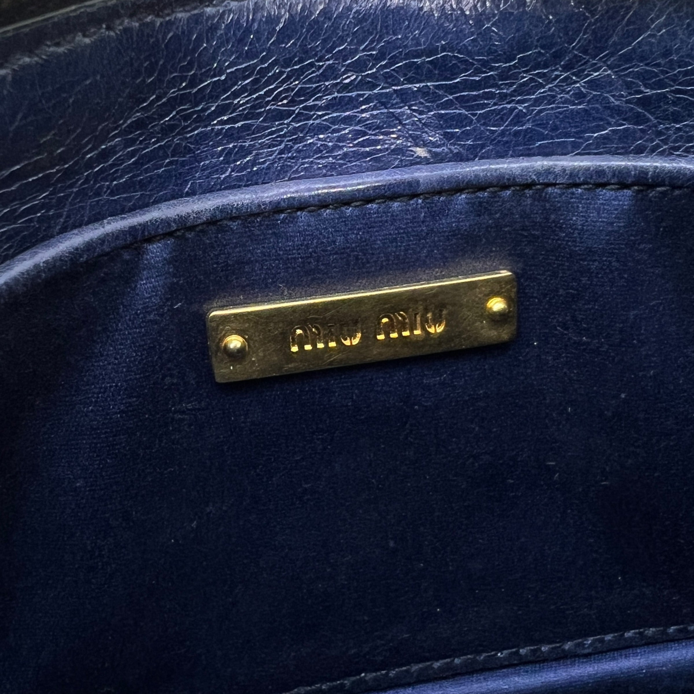 Mini borsa in pelle goffrata