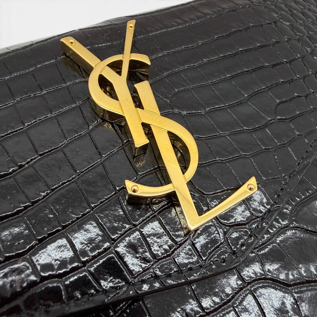 Pochette Uptownin pelle lucida coccodrillo