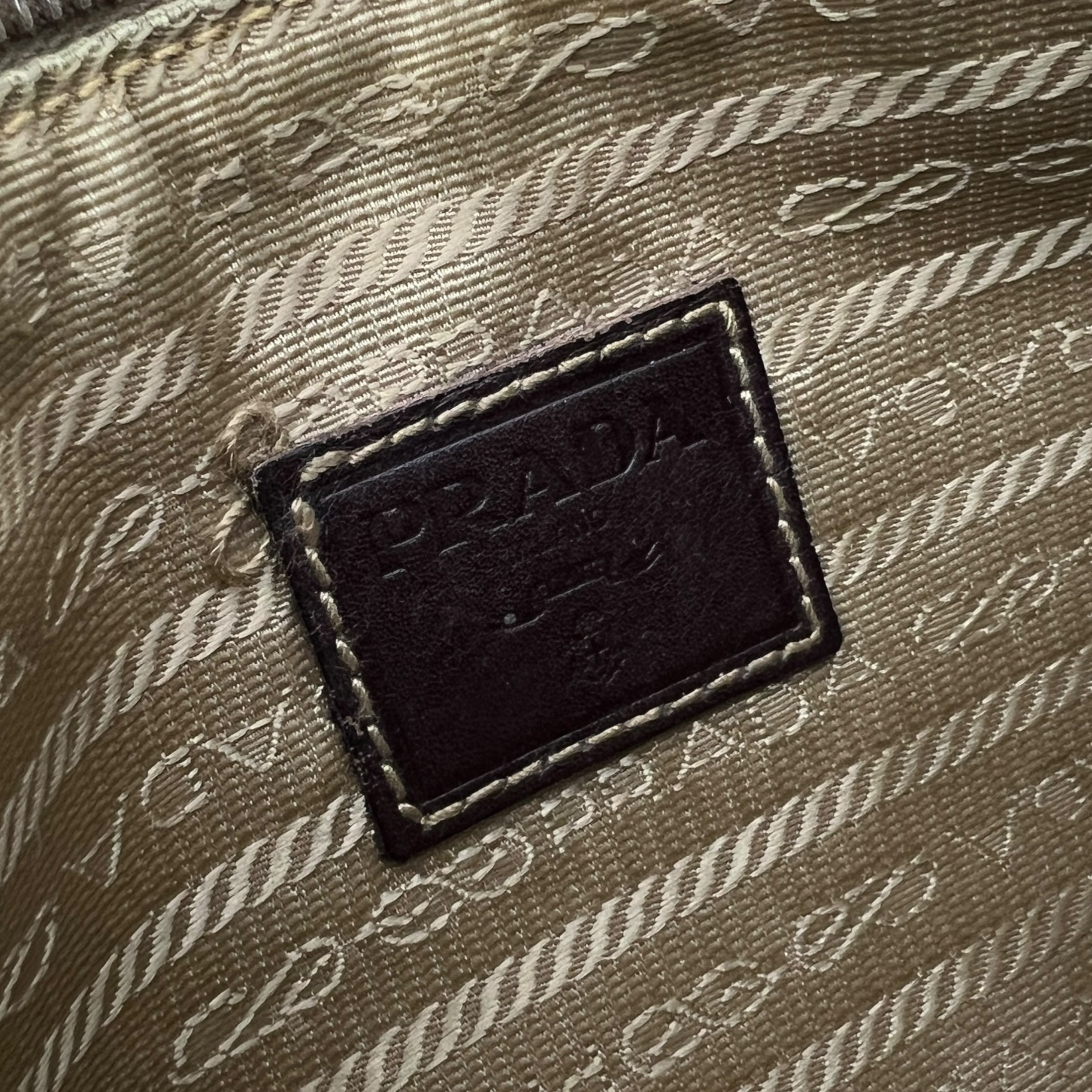 Pochette in tessuto e pelle