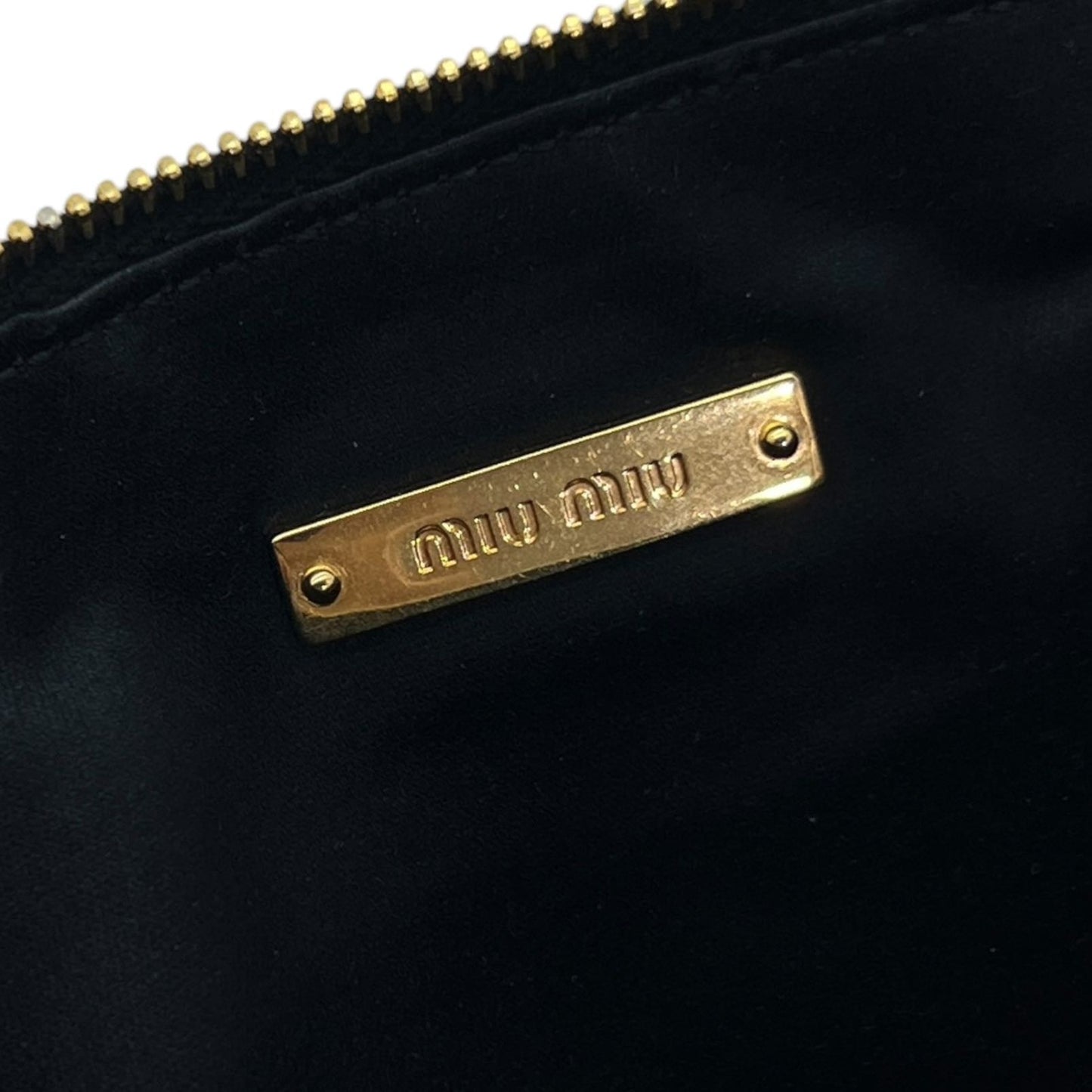 MIU MIU POCHETTE IN PELLE GOFFRATA NERA