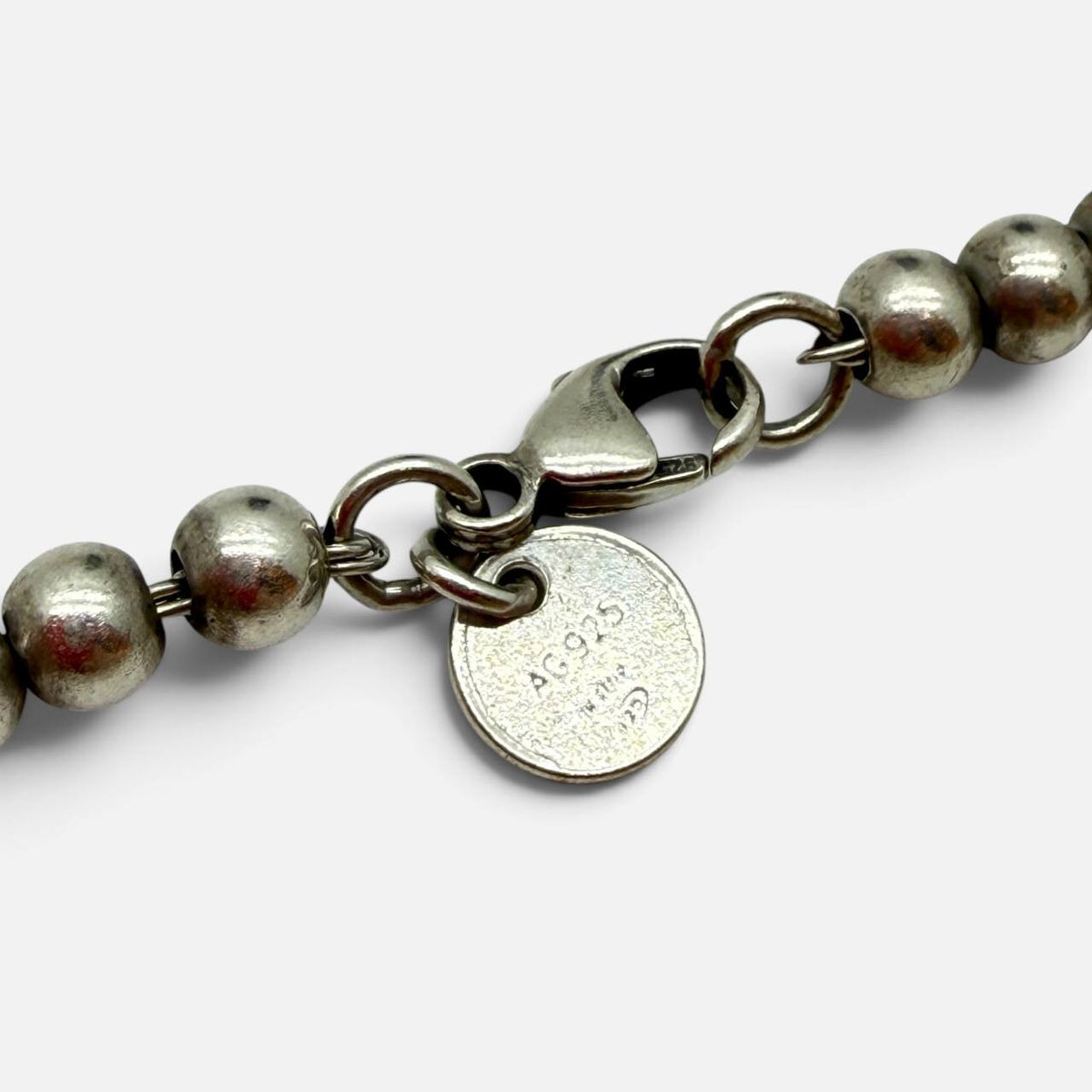 Bracciale Return to Tiffany in argento con pendente smaltato